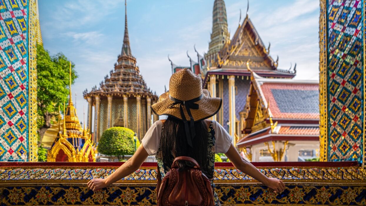 Tourist looking at temples in Bangkok, Thailand